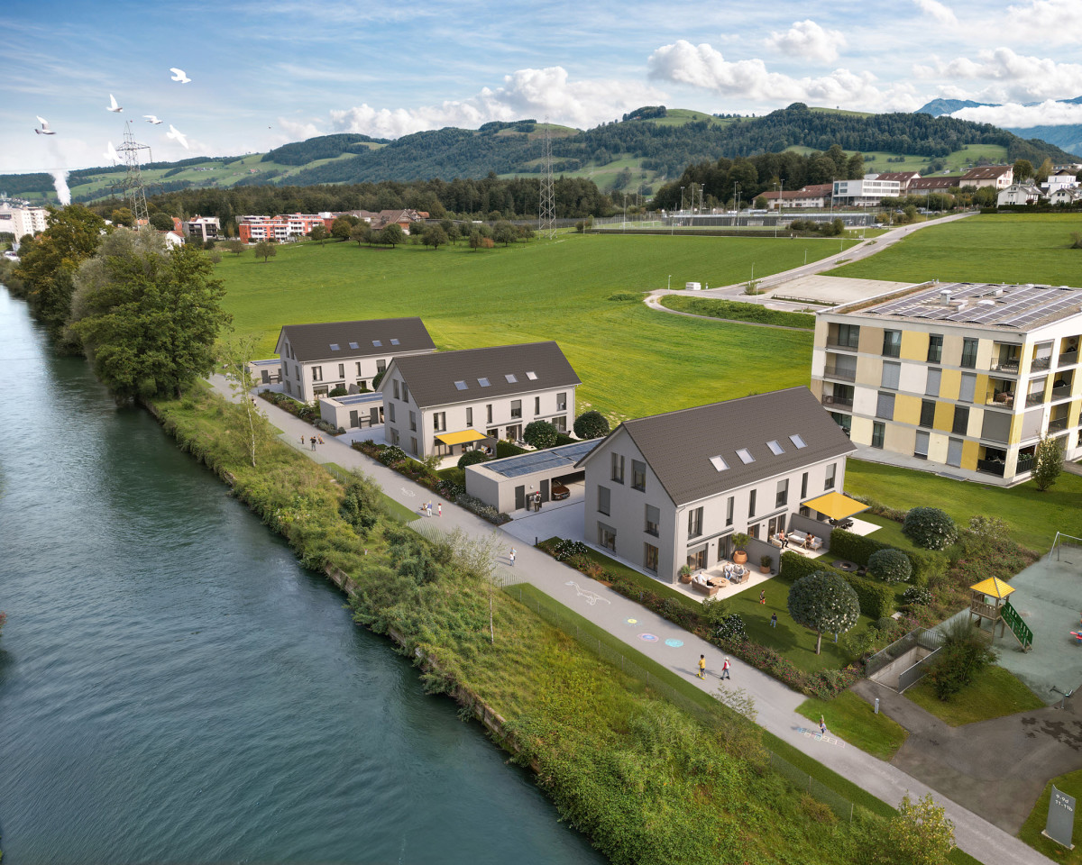 Am idyllischen Reusskanal entstehen die neun 6-Zimmer-Häuser in Holzbauweise