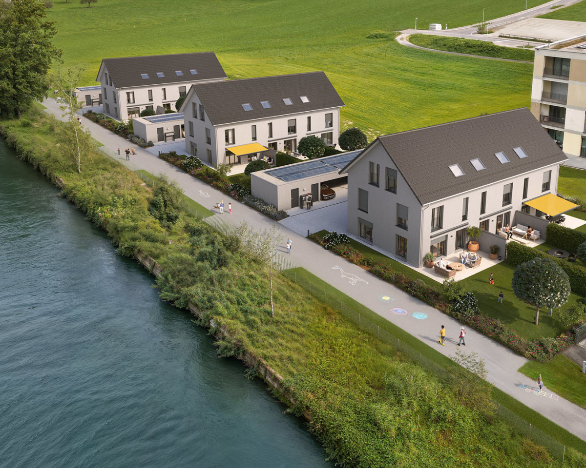 Am idyllischen Reusskanal entstehen die neun 6-Zimmer-Häuser in Holzbauweise